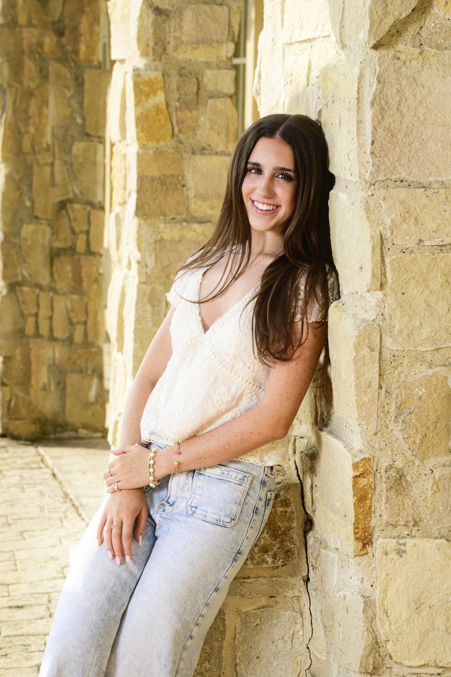 ImageStella celebrating her senior year with an outdoor portrait at Adriatica in McKinney, Texas. Becoming a confident young adult.et dancing.